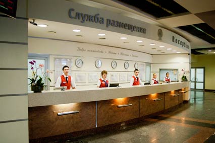 Стойка бронирования в отеле Гамма-Дельта Фотография стойки бронирования Гамма-Дельта